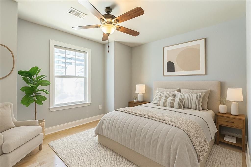 242 16th Street Northwest, Unit 14 Atlanta, GA 30363 - Photo 23 of 31 a bedroom with a bed and furniture