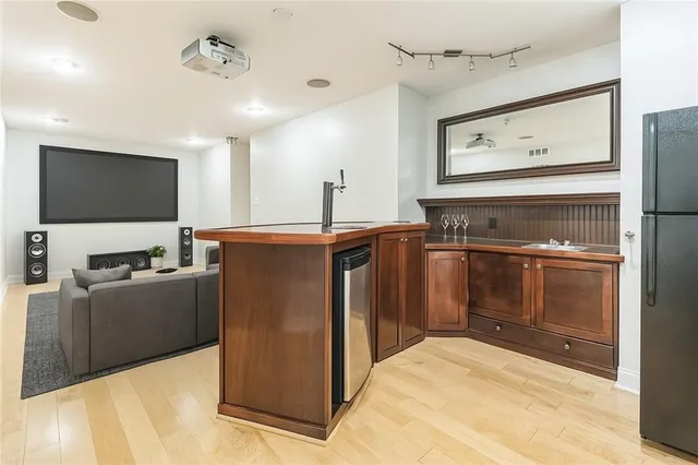 a kitchen with cabinets and stainless steel appliances