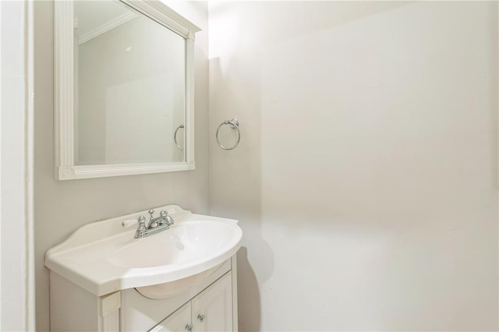 242 16th Street Northwest, Unit 14 Atlanta, GA 30363 - Photo 28 of 31 a bathroom with a sink a shower and a mirror