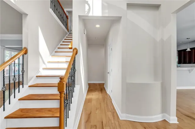 a view of staircase with white walls