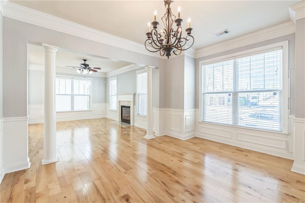 242 16th Street Northwest, Unit 14 Atlanta, GA 30363 - Photo 5 of 31 a view of an empty room with a window and wooden floor