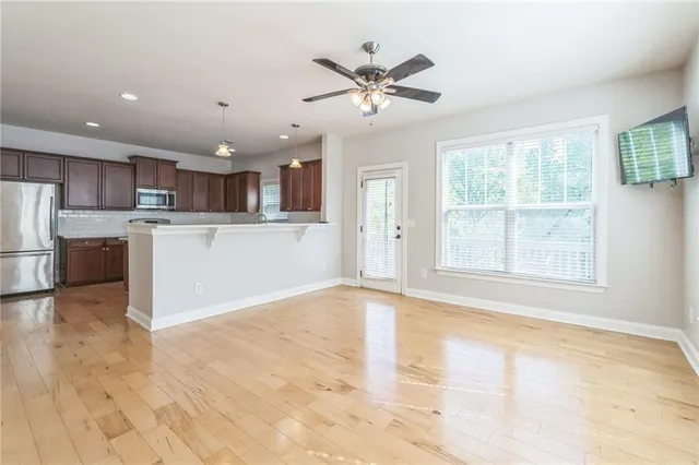a view of a kitchen with a sink and a window