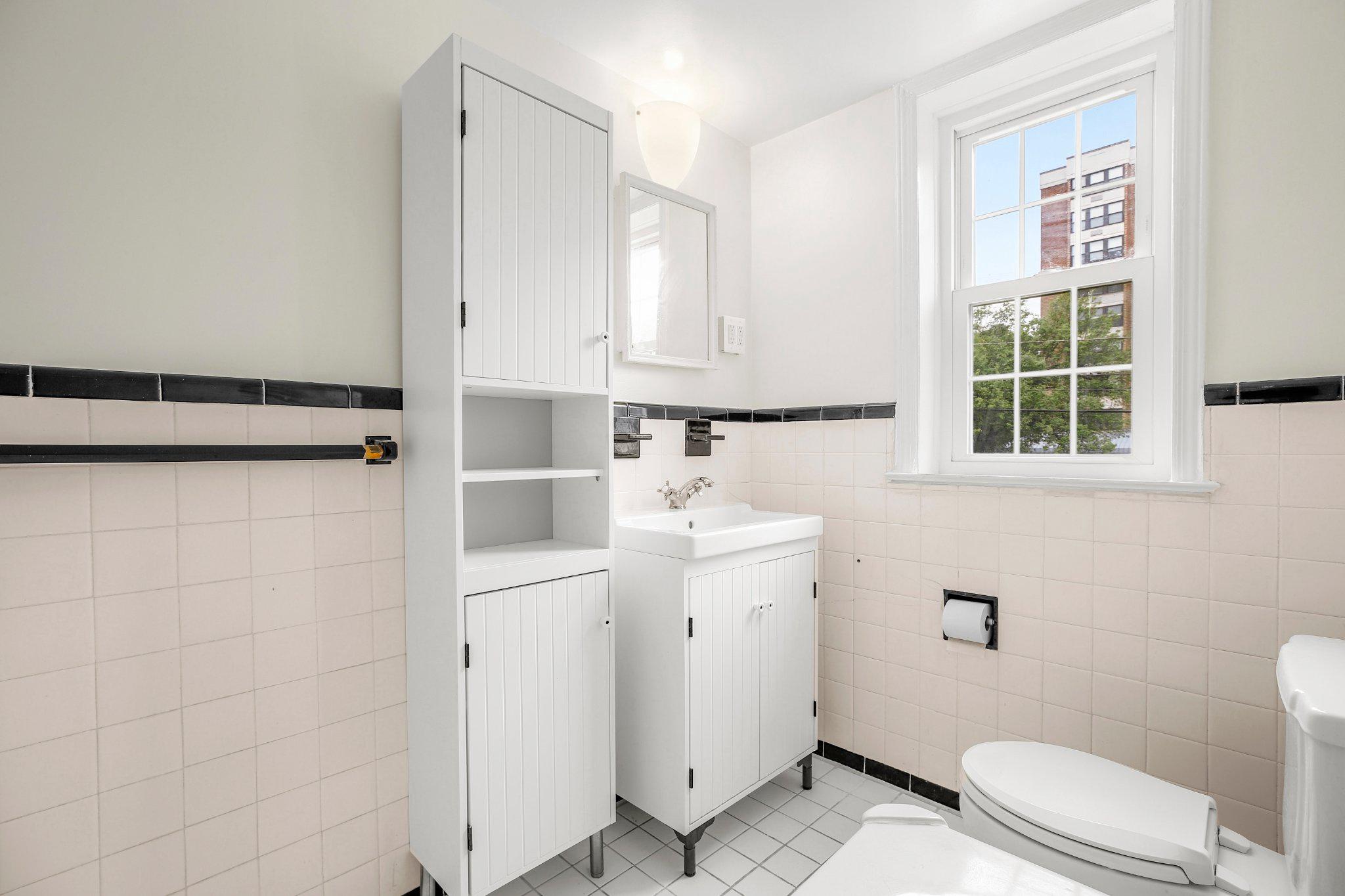2202 Colston Drive, Unit 102 Silver Spring, MD 20910 - Photo 20 of 38 a bathroom with a sink a toilet and shower