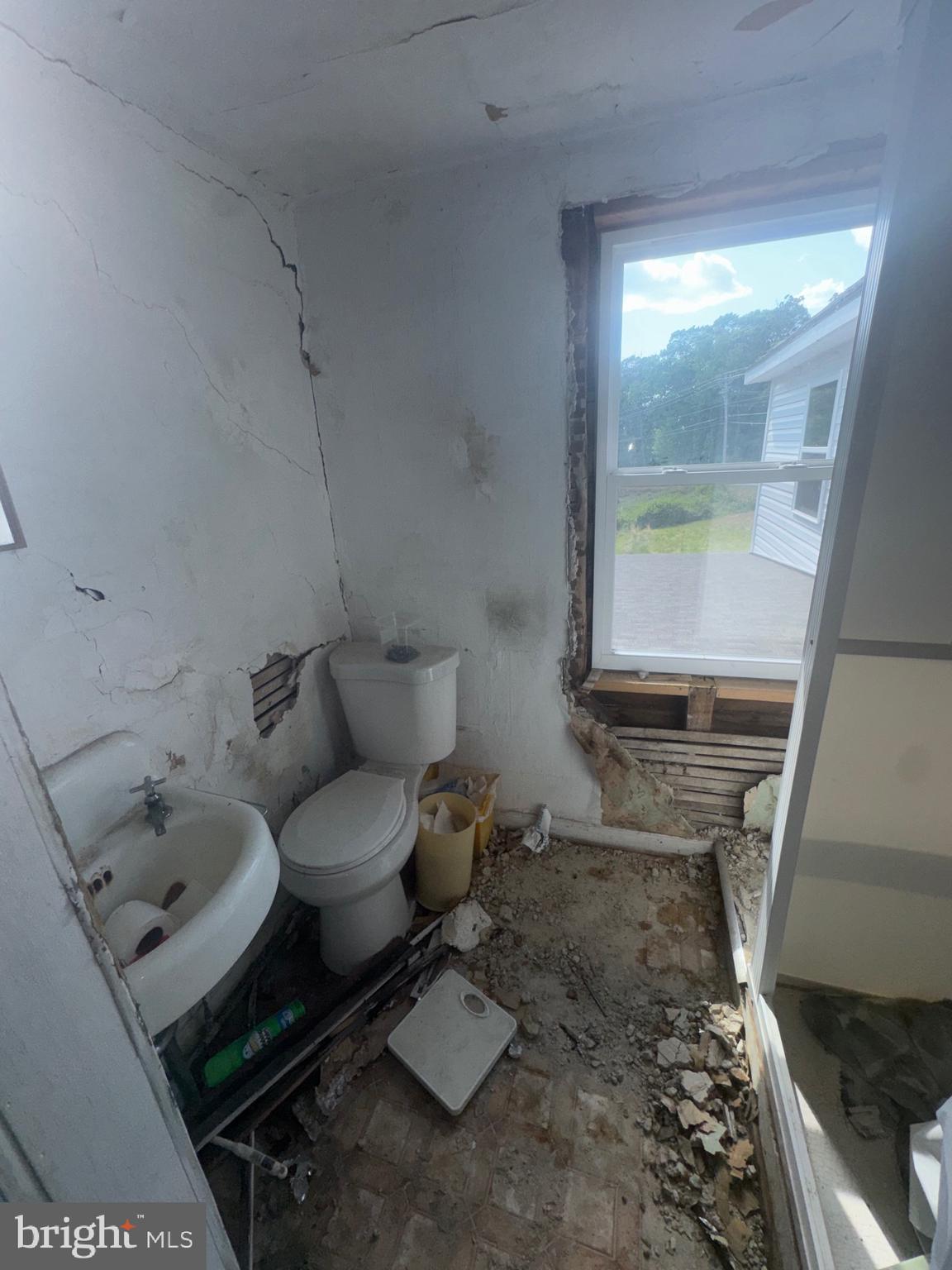 1650 Skinners Turn Road Owings, MD 20736 - Photo 21 of 66 a bathroom with a toilet sink and mirror