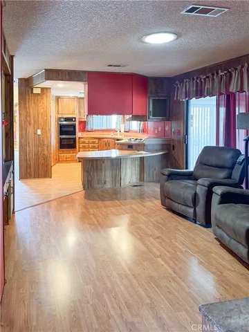 an empty room with closet and mirror