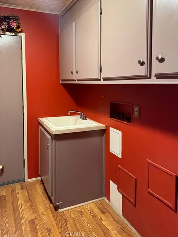 a bathroom with a sink vanity mirror and toilet