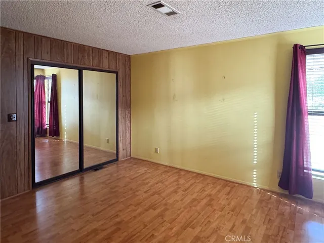 a kitchen with a wooden floor and a stove