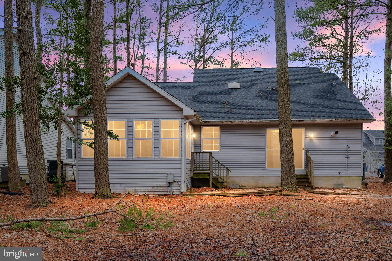 37 Watertown Road Ocean Pines, MD 21811 - Photo 2 of 86 a front view of a house with a yard and garage
