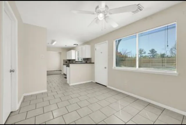 a view of kitchen with furniture and window
