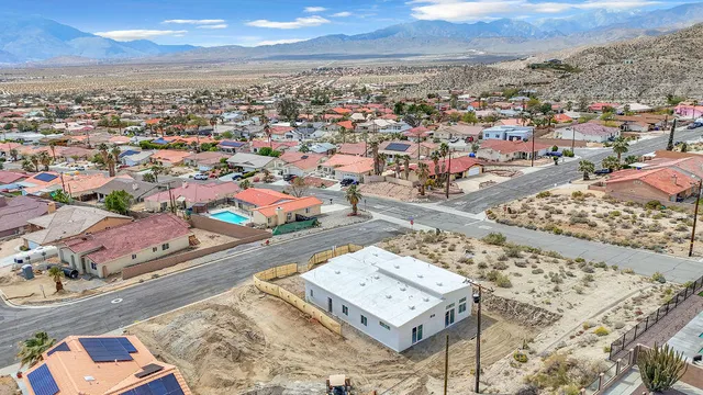 an aerial view of residential houses with outdoor space