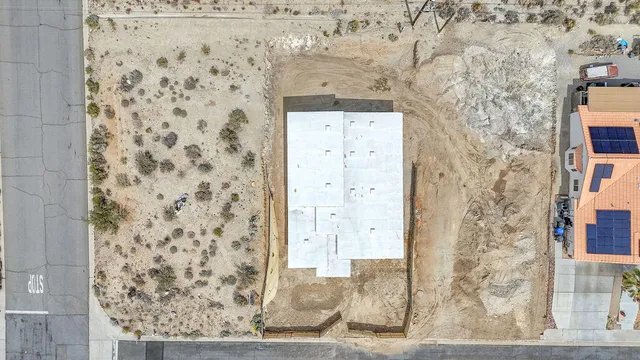 an aerial view of residential house and green space