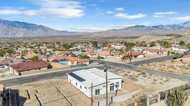 an aerial view of residential houses with outdoor space