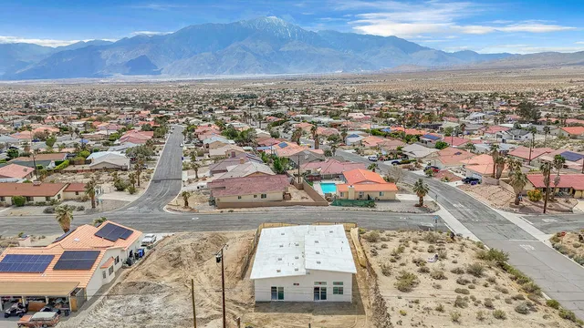 a large kitchen with stainless steel appliances granite countertop a stove and a sink