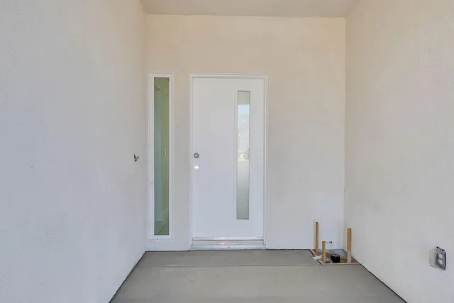 a large kitchen with stainless steel appliances granite countertop a stove a sink and a microwave