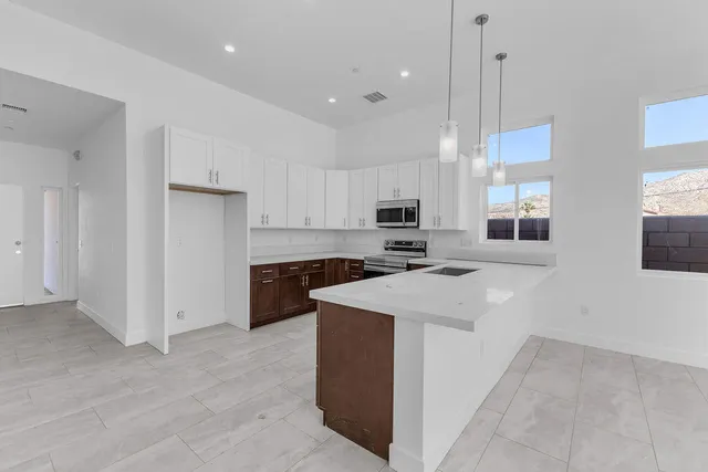 a kitchen with a sink and cabinets