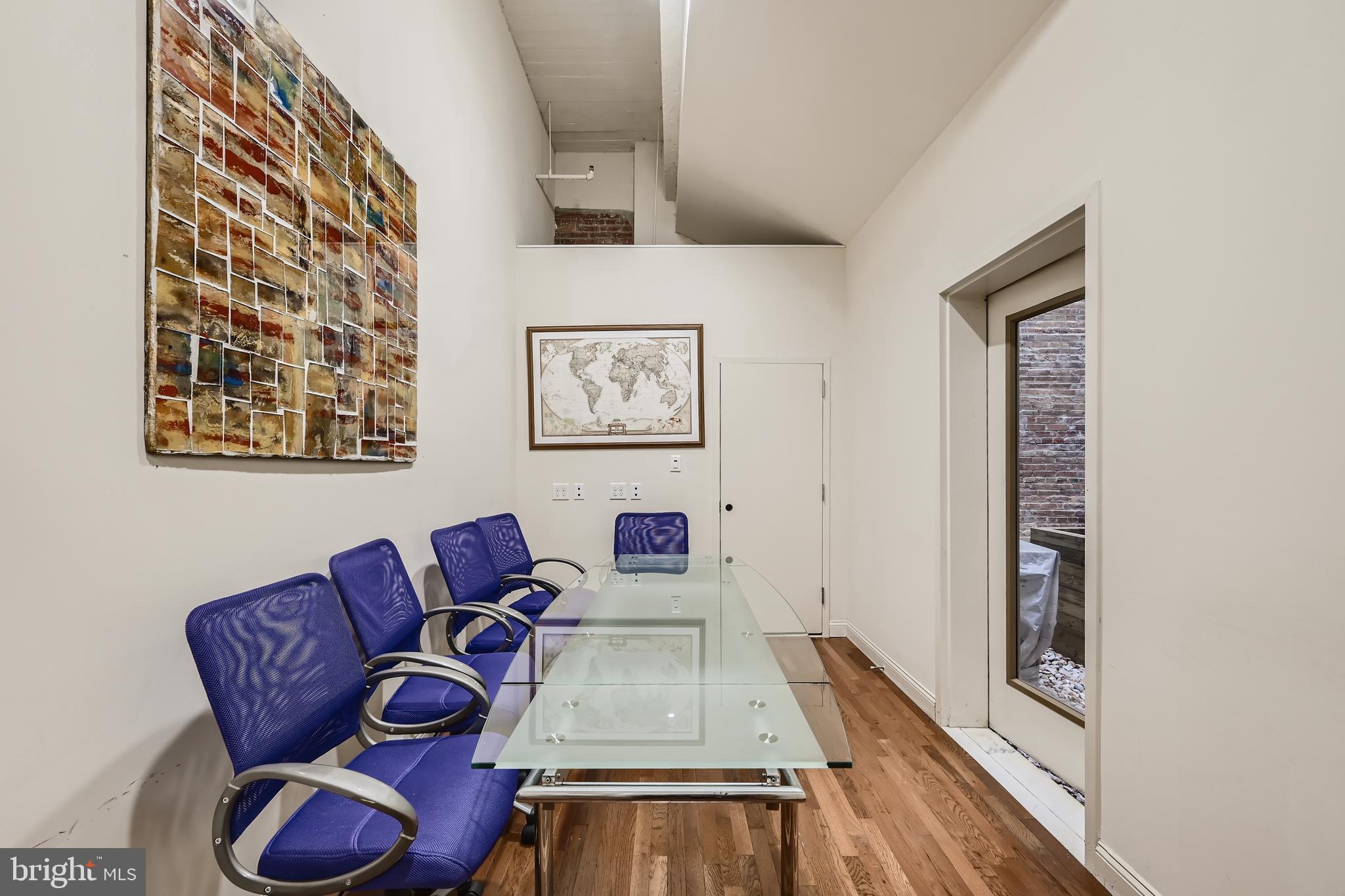 311 West Baltimore Street, Unit 401 Baltimore, MD 21201 - Photo 16 of 28 a living room with furniture and a flat screen tv