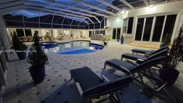 a view of a chairs and table in the patio