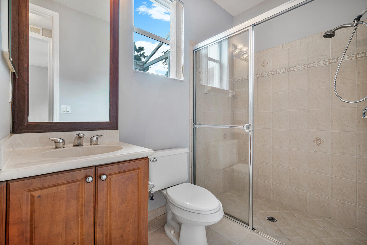 415 Mulberry Grove Road Royal Palm Beach, FL 33411 - Photo 13 of 39 a bathroom with a sink toilet and shower