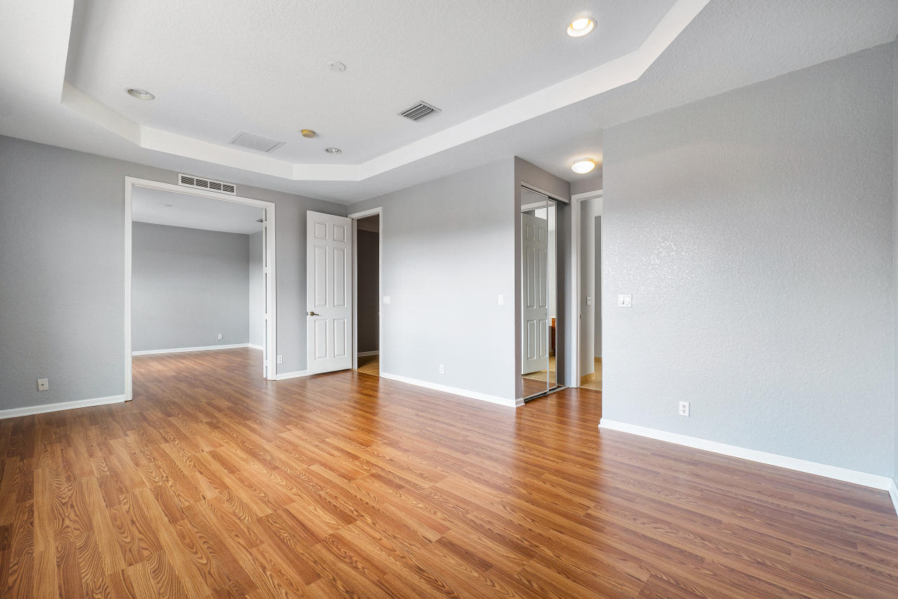 415 Mulberry Grove Road Royal Palm Beach, FL 33411 - Photo 18 of 39 a view of an empty room with wooden floor