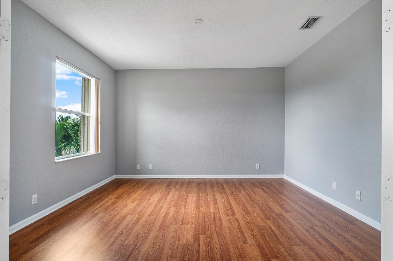 415 Mulberry Grove Road Royal Palm Beach, FL 33411 - Photo 20 of 39 a view of room with window and wooden floor