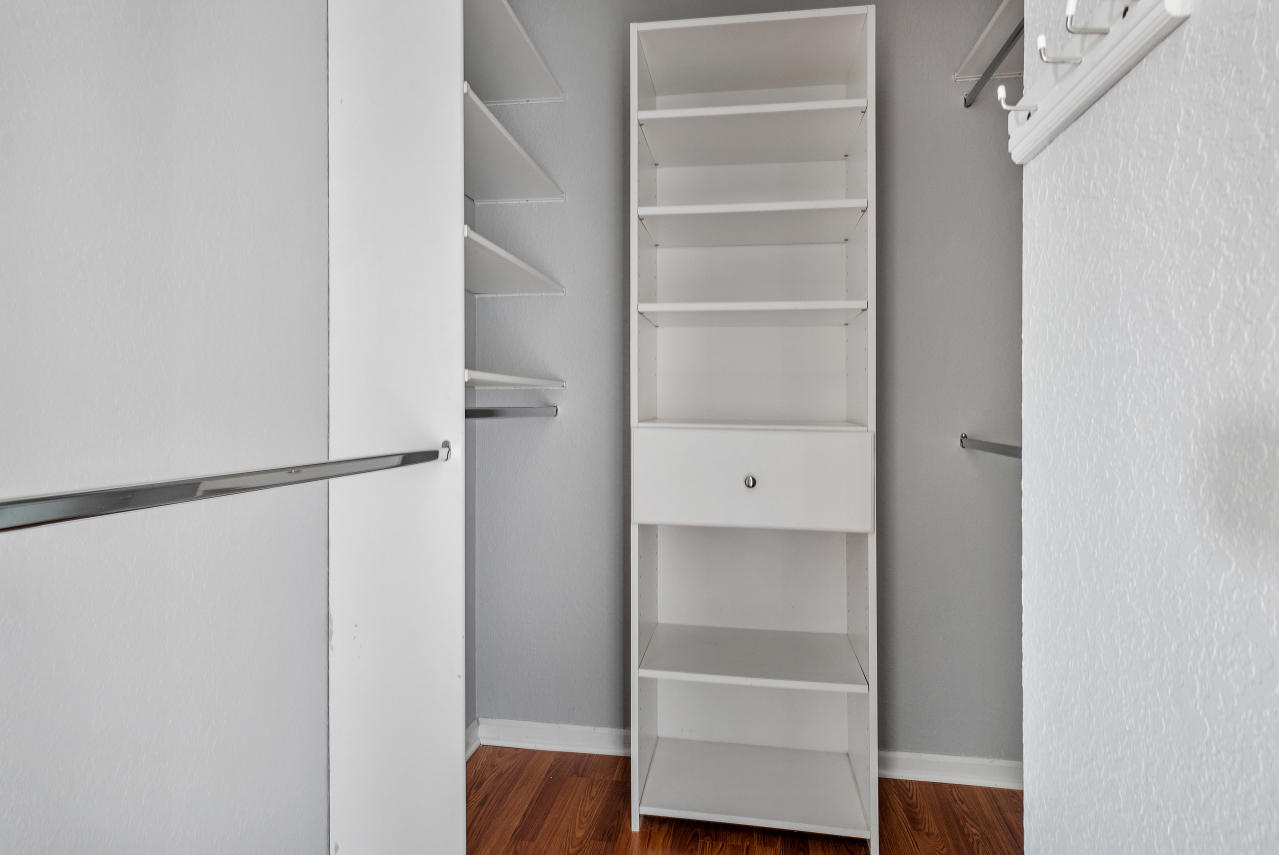 415 Mulberry Grove Road Royal Palm Beach, FL 33411 - Photo 21 of 39 a view of walk in closet with empty racks