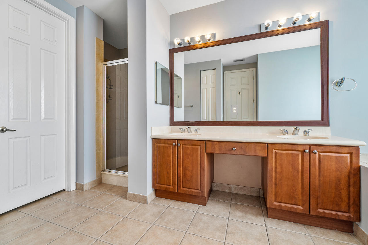 415 Mulberry Grove Road Royal Palm Beach, FL 33411 - Photo 23 of 39 a bathroom with a sink and a mirror