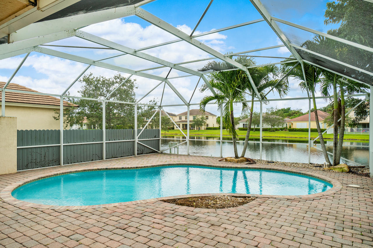 415 Mulberry Grove Road Royal Palm Beach, FL 33411 - Photo 28 of 39 a view of a swimming pool with a patio