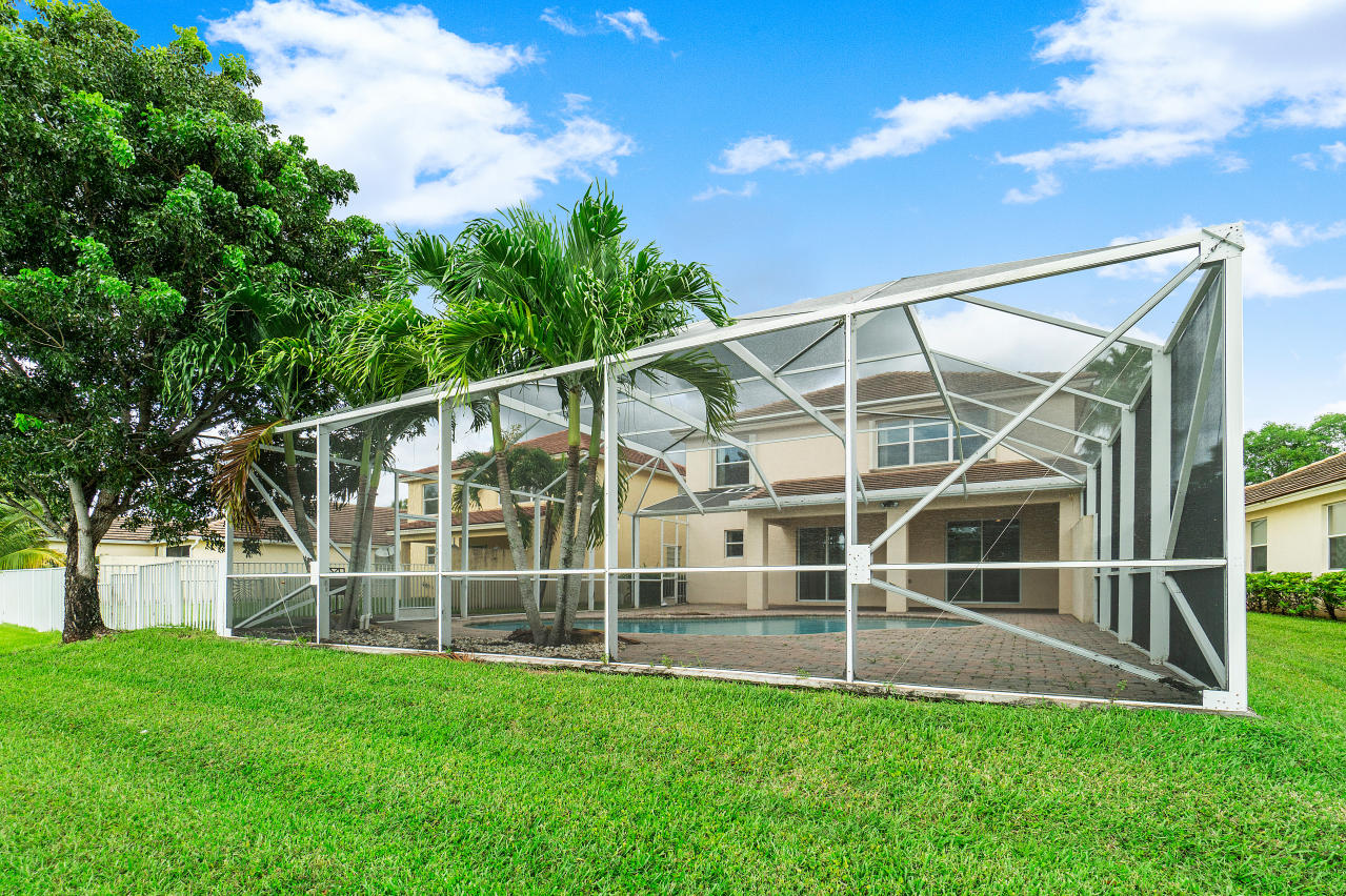 415 Mulberry Grove Road Royal Palm Beach, FL 33411 - Photo 33 of 39 a view of an empty space with a big yard and a garden view