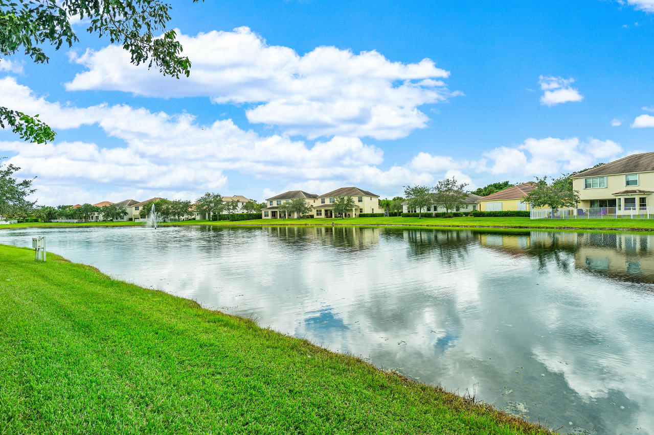 415 Mulberry Grove Road Royal Palm Beach, FL 33411 - Photo 34 of 39 a view of a lake with a city