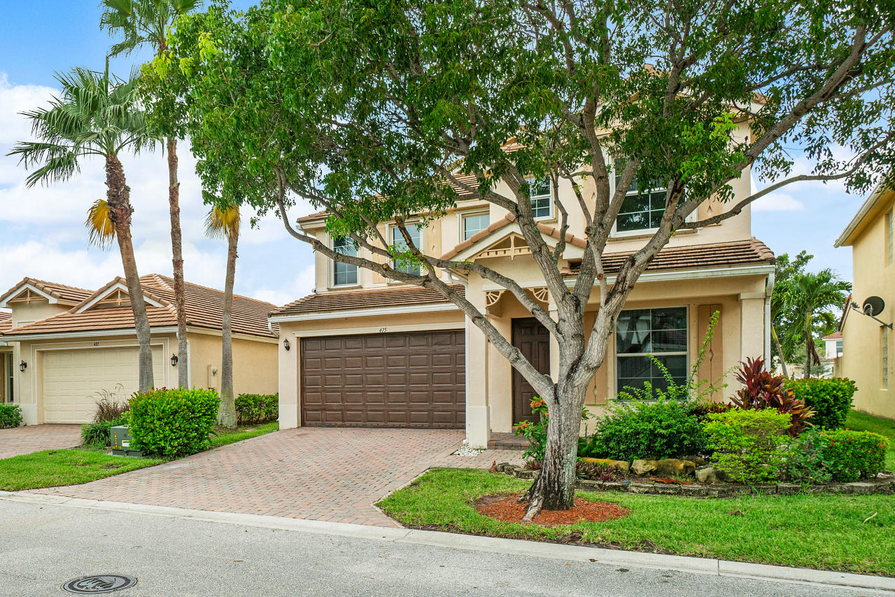 415 Mulberry Grove Road Royal Palm Beach, FL 33411 - Photo 38 of 39 a front view of a house with garden