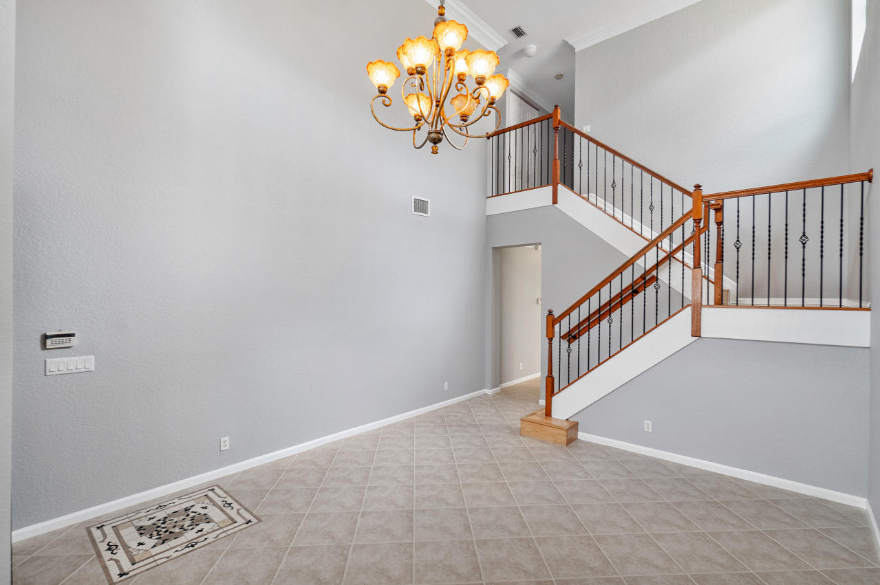 415 Mulberry Grove Road Royal Palm Beach, FL 33411 - Photo 4 of 39 a view of entryway with a chandelier