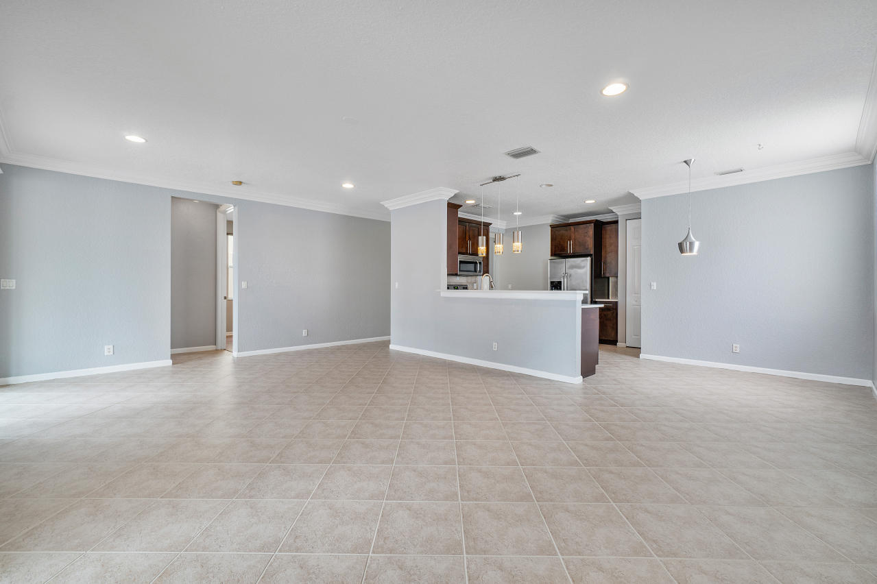 415 Mulberry Grove Road Royal Palm Beach, FL 33411 - Photo 9 of 39 a view of a kitchen with a sink and dishwasher cabinets
