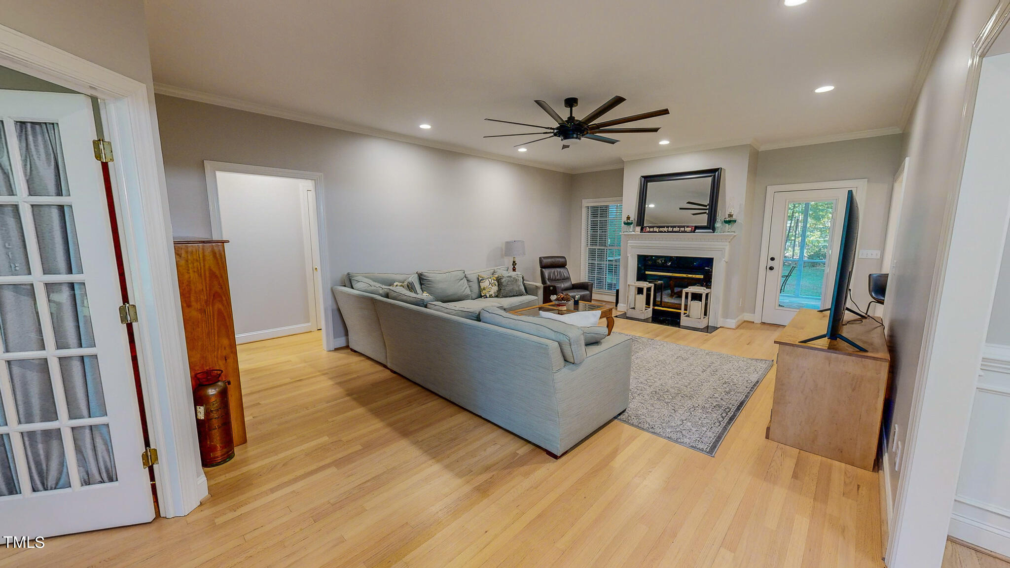 269 Oaks Lane Road Timberlake, NC 27583 - Photo 11 of 51 a living room with furniture wooden floor and a fireplace