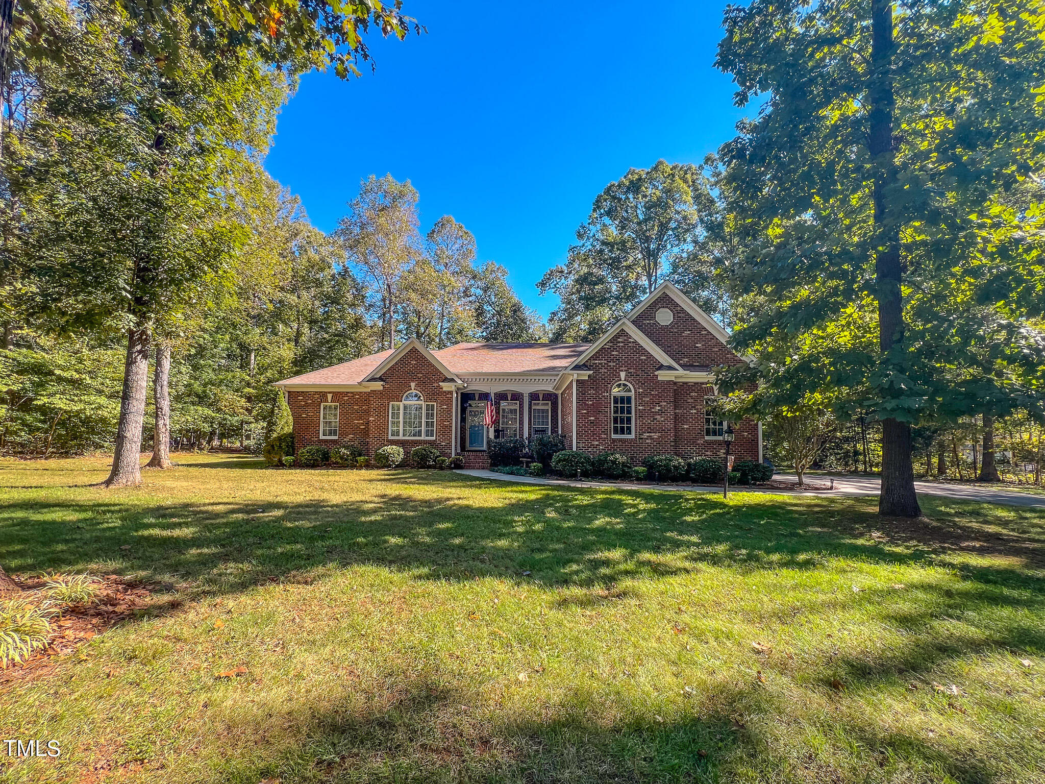 269 Oaks Lane Road Timberlake, NC 27583 - Photo 15 of 51 a front view of a house with a big yard