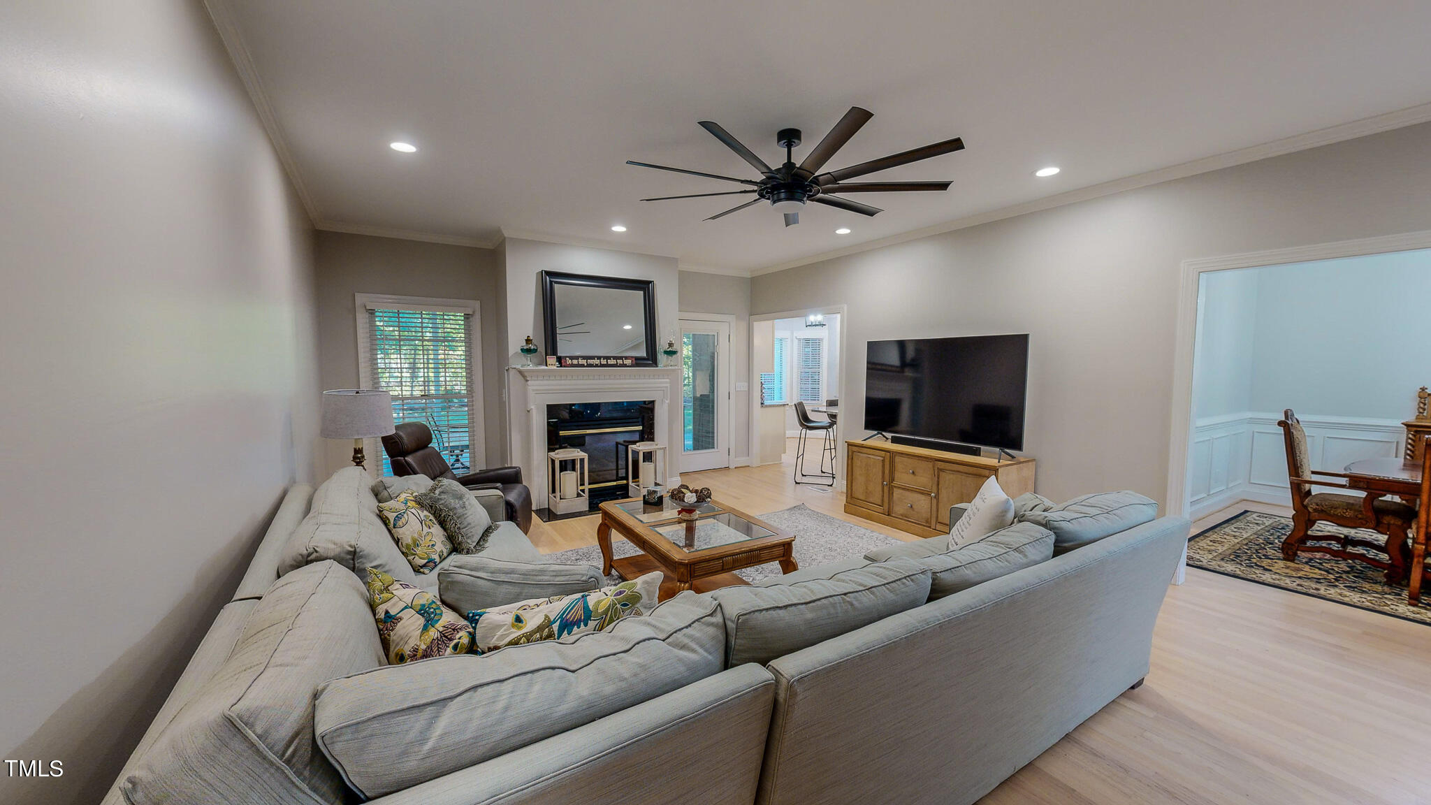 269 Oaks Lane Road Timberlake, NC 27583 - Photo 19 of 51 a living room with furniture a fireplace and a flat screen tv