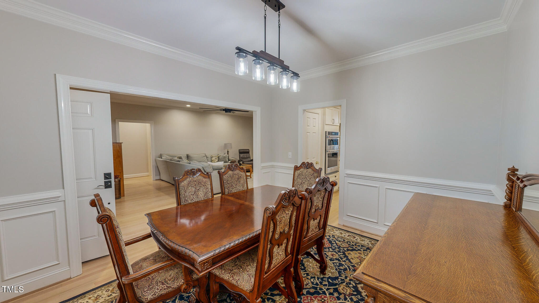 269 Oaks Lane Road Timberlake, NC 27583 - Photo 28 of 51 a view of a dining room with furniture and wooden floor