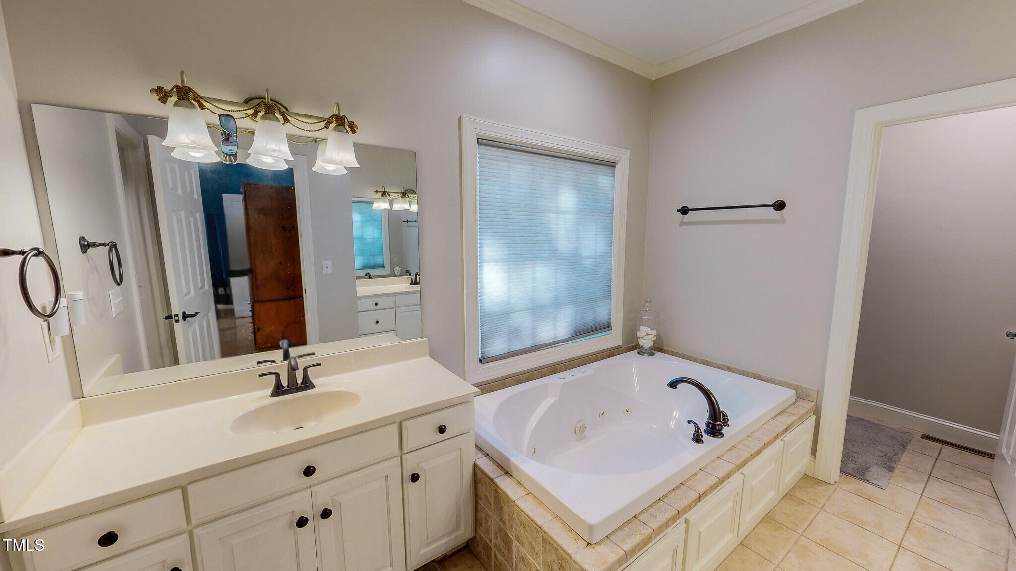 269 Oaks Lane Road Timberlake, NC 27583 - Photo 32 of 51 a bathroom with a tub sink and mirror