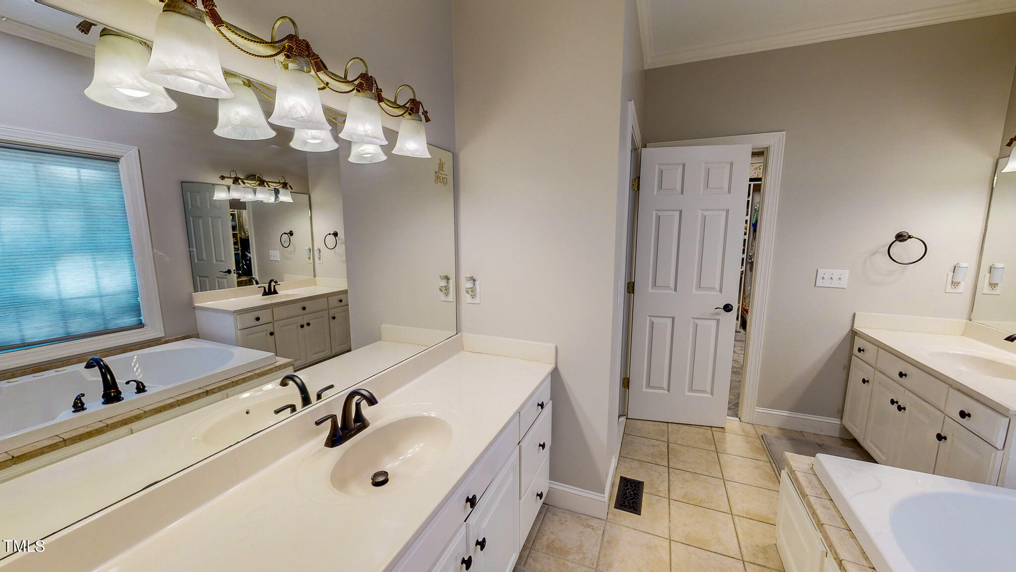 269 Oaks Lane Road Timberlake, NC 27583 - Photo 34 of 51 a bathroom with a sink vanity tub and a mirror