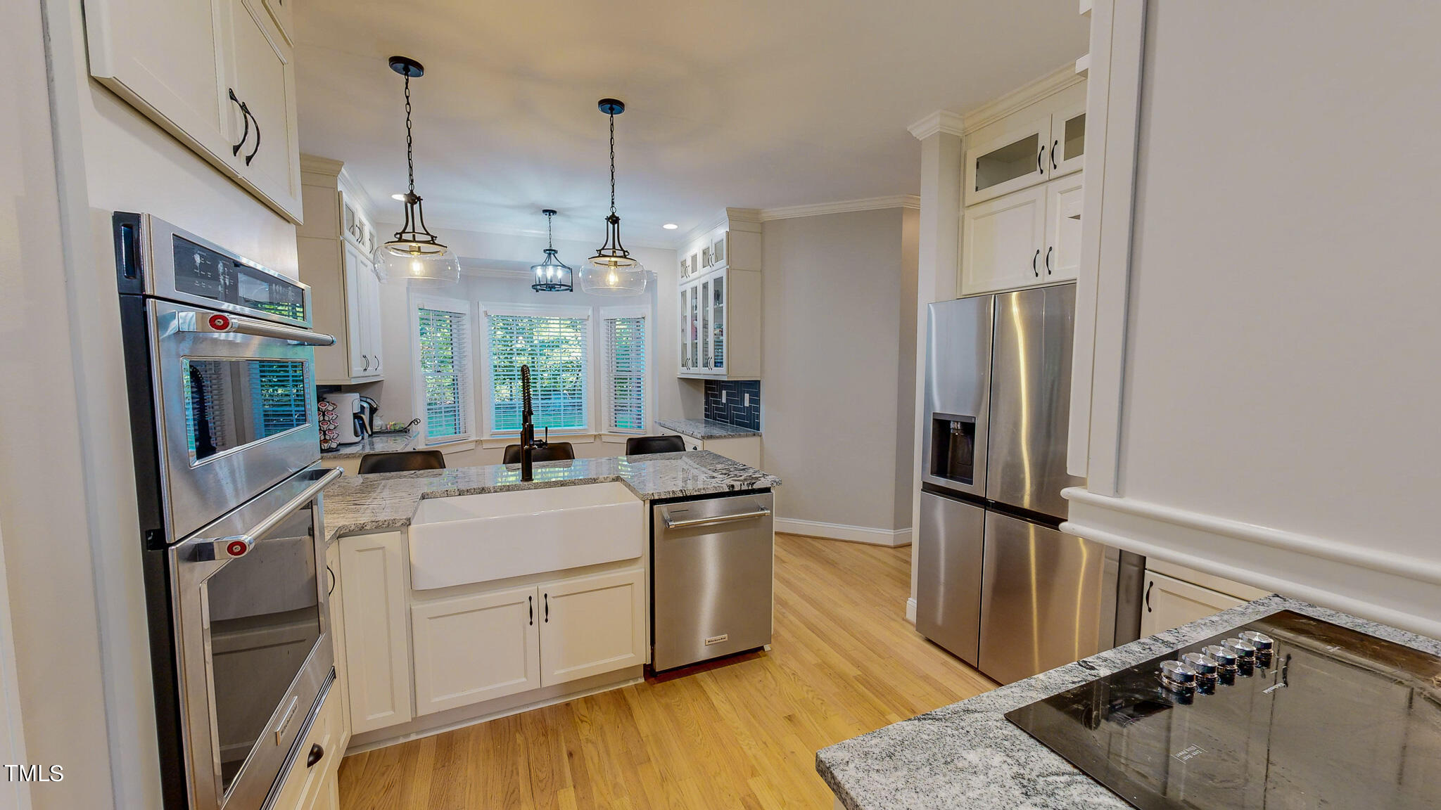 269 Oaks Lane Road Timberlake, NC 27583 - Photo 6 of 51 a kitchen with a sink stainless steel appliances a refrigerator and a stove