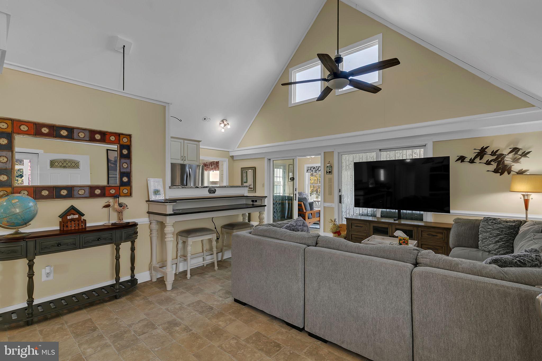 1887 Point Breeze Road Hudgins, VA 23076 - Photo 48 of 77 a living room with furniture and a flat screen tv
