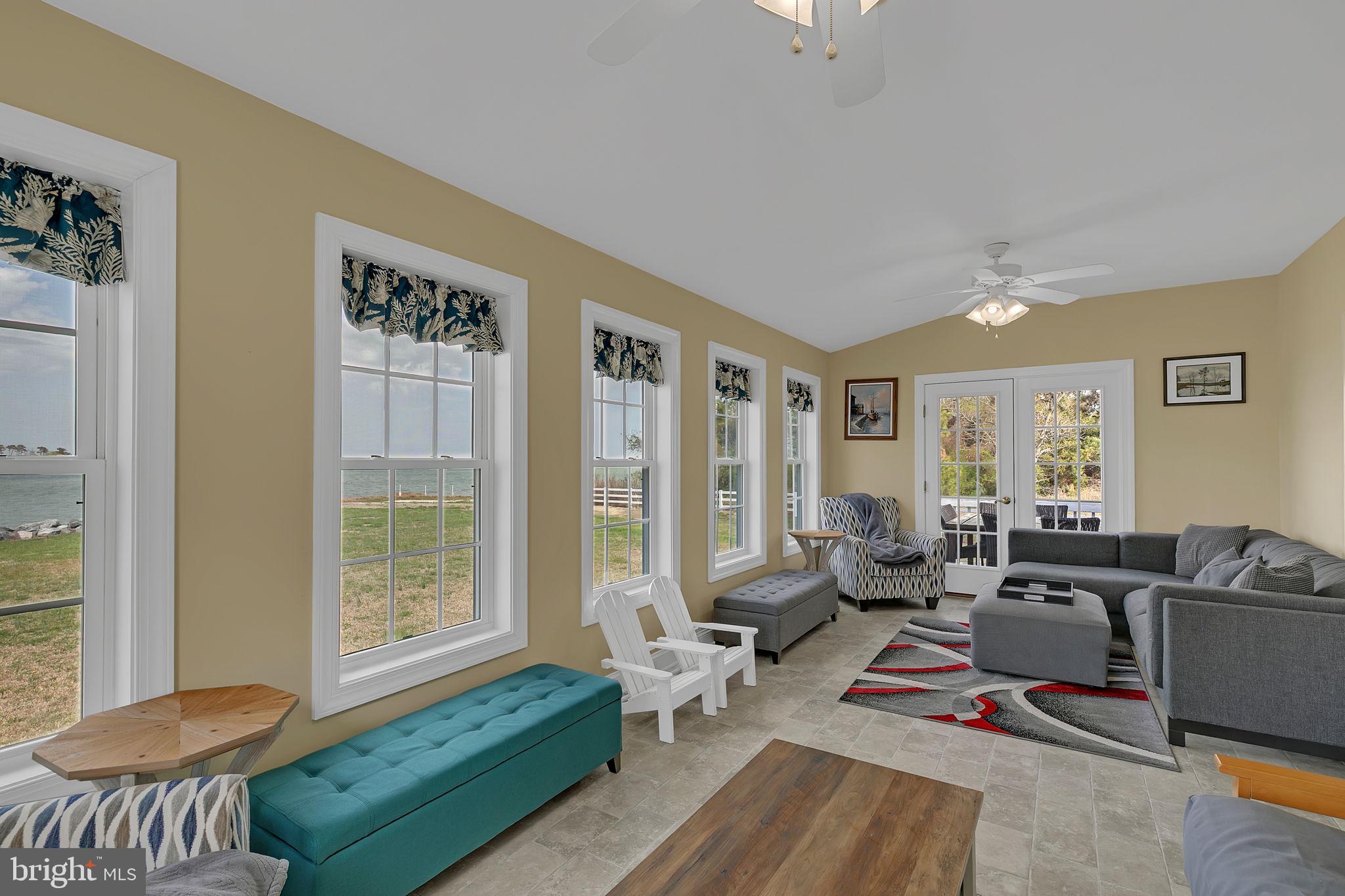 1887 Point Breeze Road Hudgins, VA 23076 - Photo 55 of 77 a living room with furniture and a large window