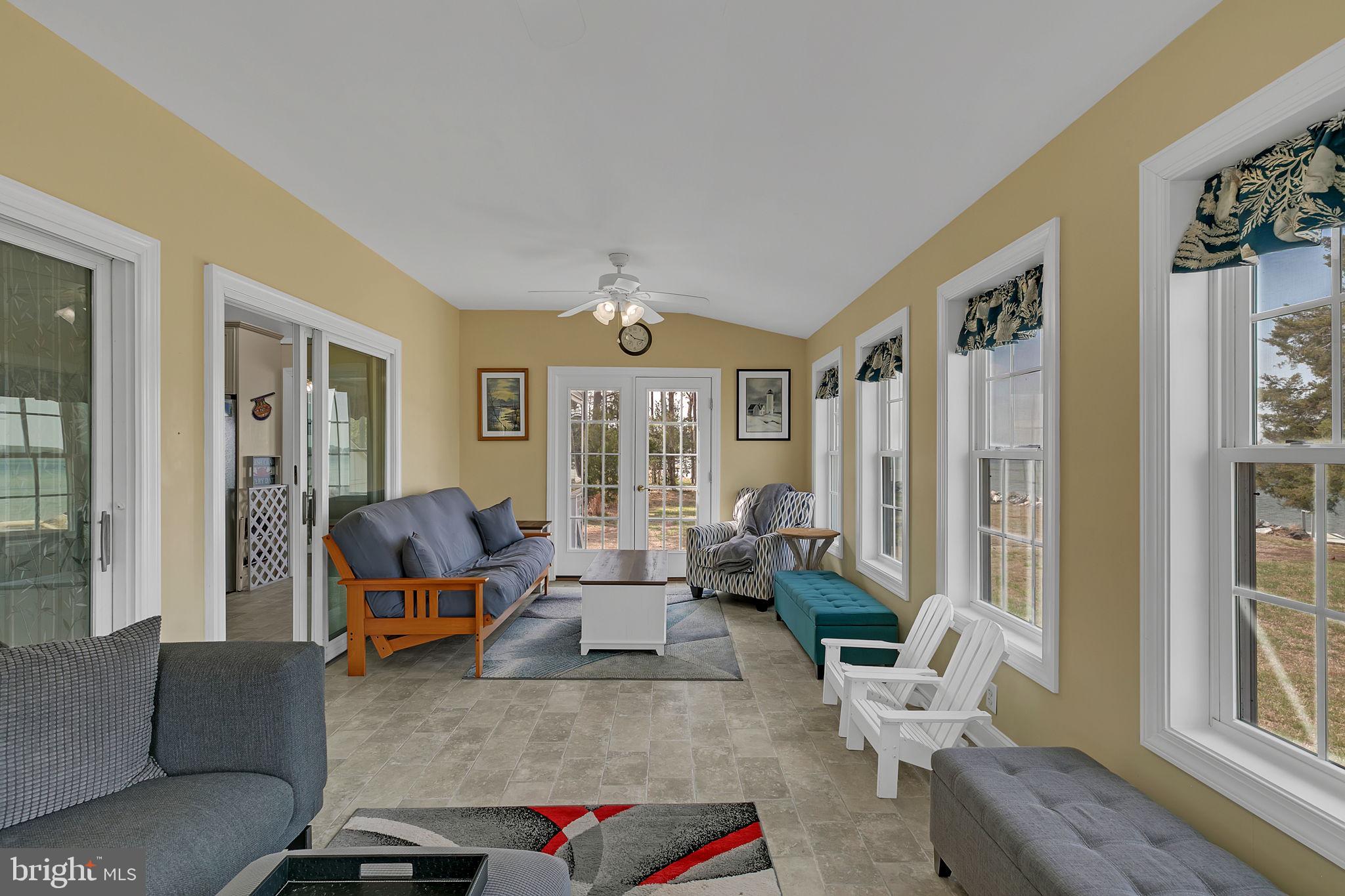 1887 Point Breeze Road Hudgins, VA 23076 - Photo 56 of 77 a living room with furniture or couch and a window
