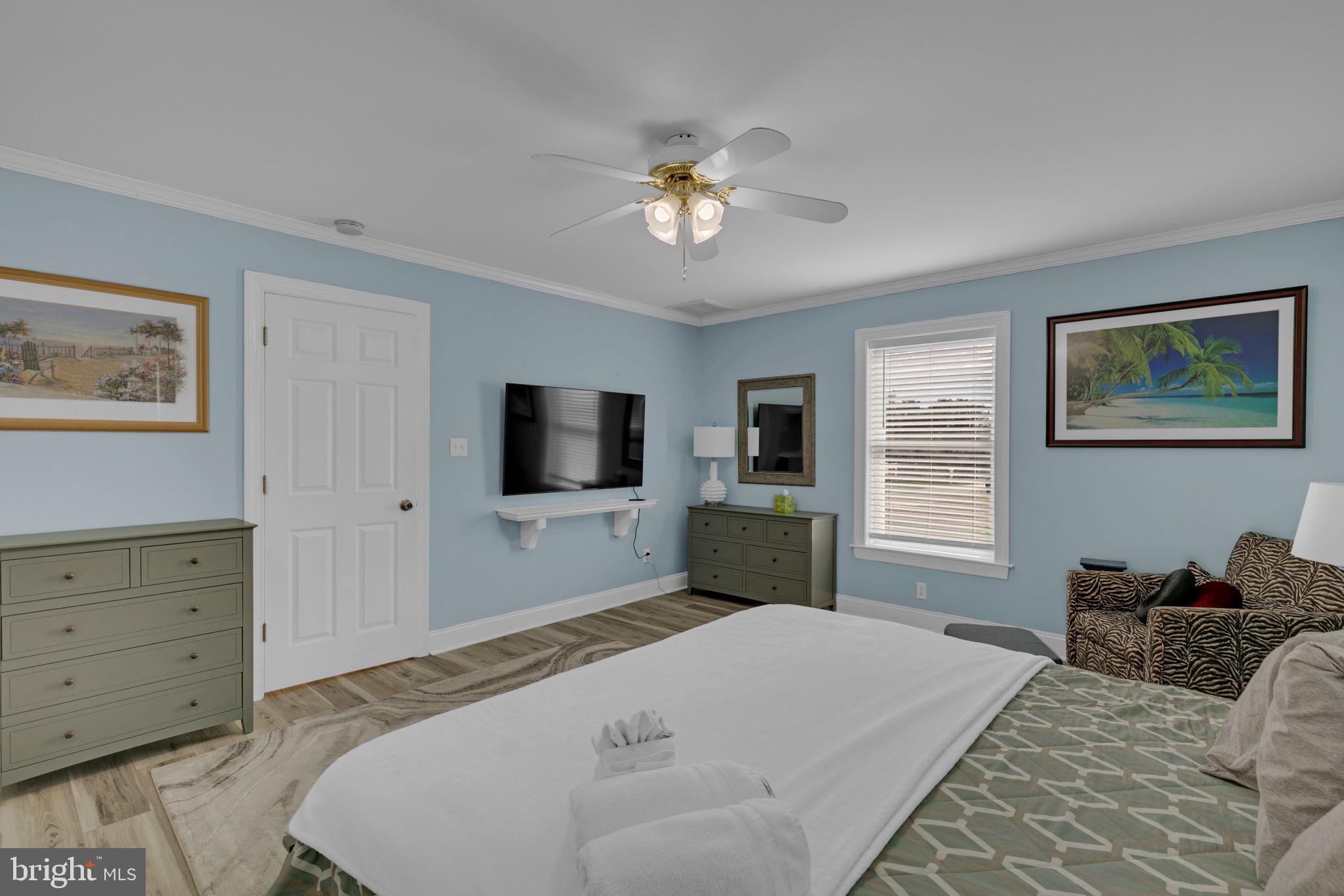 1887 Point Breeze Road Hudgins, VA 23076 - Photo 62 of 77 a bedroom with a bed and a flat screen tv