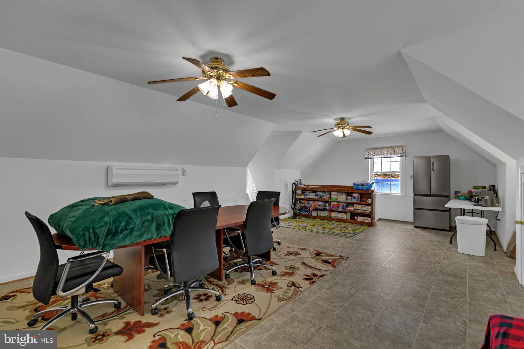 1887 Point Breeze Road Hudgins, VA 23076 - Photo 74 of 77 a living room with furniture and a chandelier