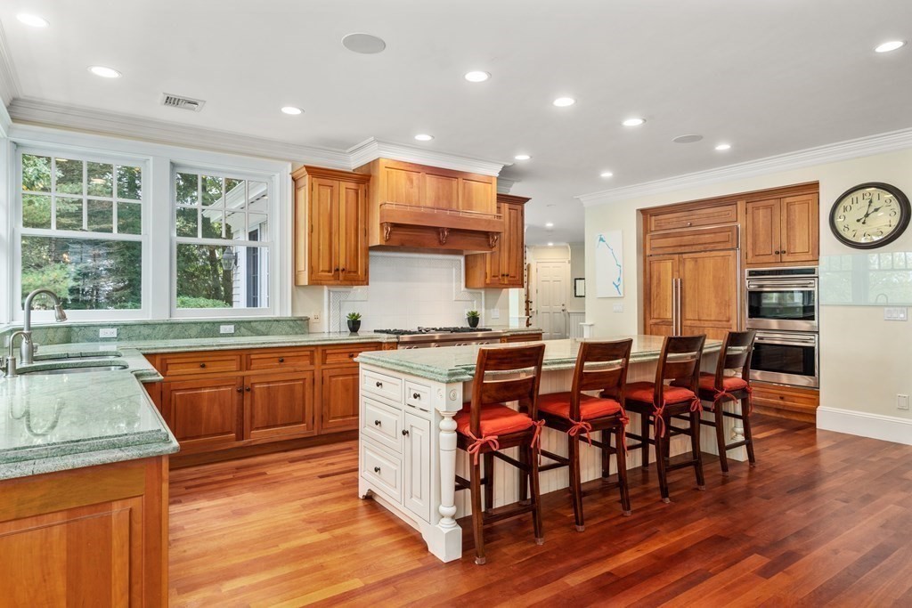 137 Forest Street Sherborn, MA 01770 - Photo 15 of 38 a large kitchen with lots of counter space and windows