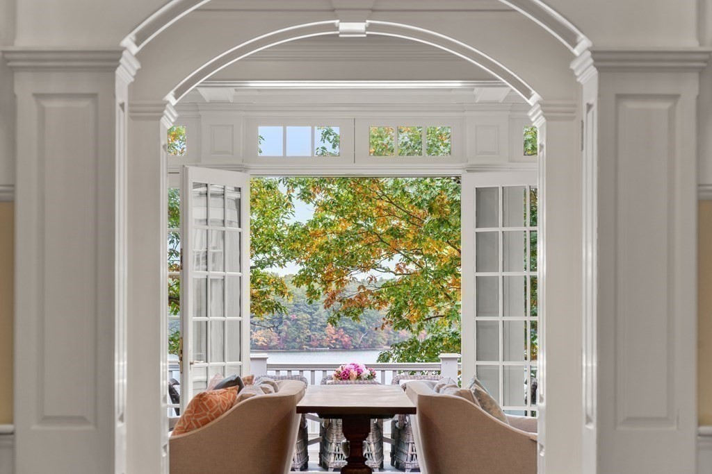 137 Forest Street Sherborn, MA 01770 - Photo 10 of 38 a living room with a large window and a table