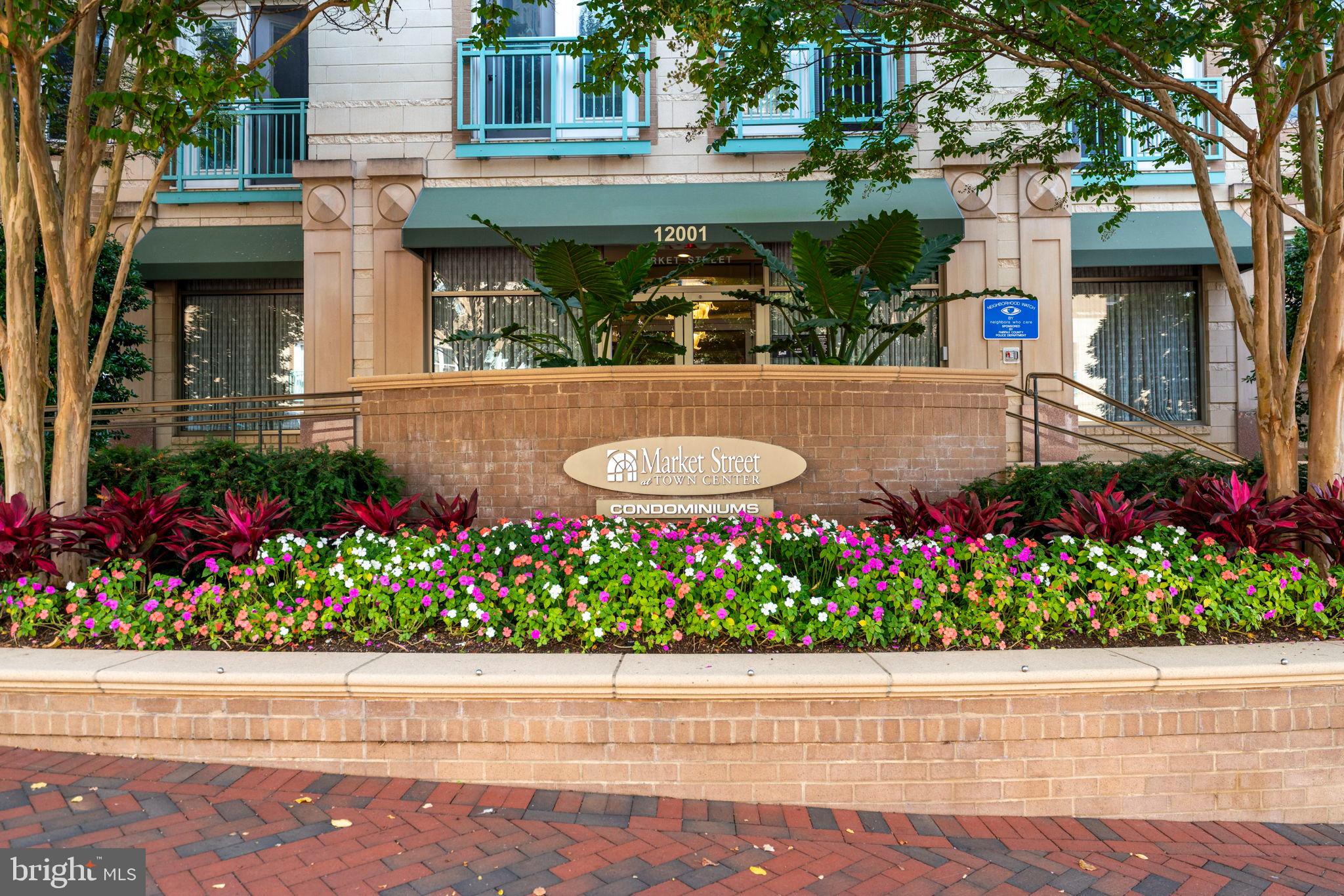 12001 Market Street, Unit 319 Reston, VA 20190 - Photo 1 of 37 Charming entrance with vibrant landscaping.