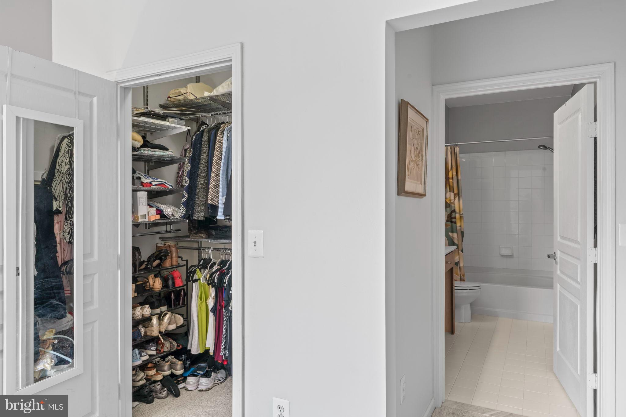 12001 Market Street, Unit 319 Reston, VA 20190 - Photo 21 of 37 Spacious closet and bathroom.