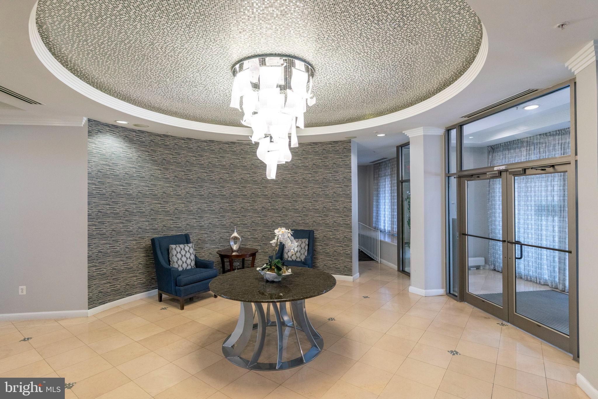 12001 Market Street, Unit 319 Reston, VA 20190 - Photo 25 of 37 Elegant entryway with modern design.