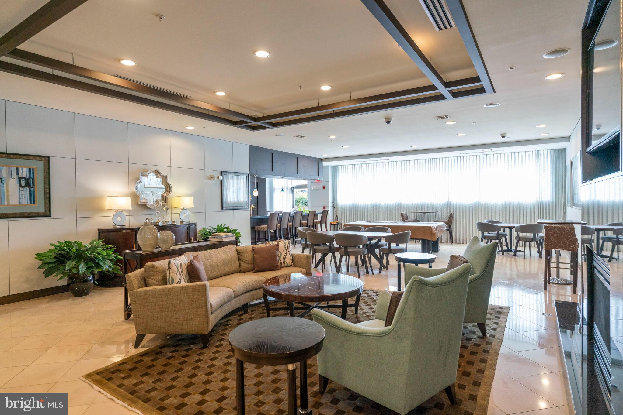 12001 Market Street, Unit 319 Reston, VA 20190 - Photo 26 of 37 Modern lounge with inviting ambiance.